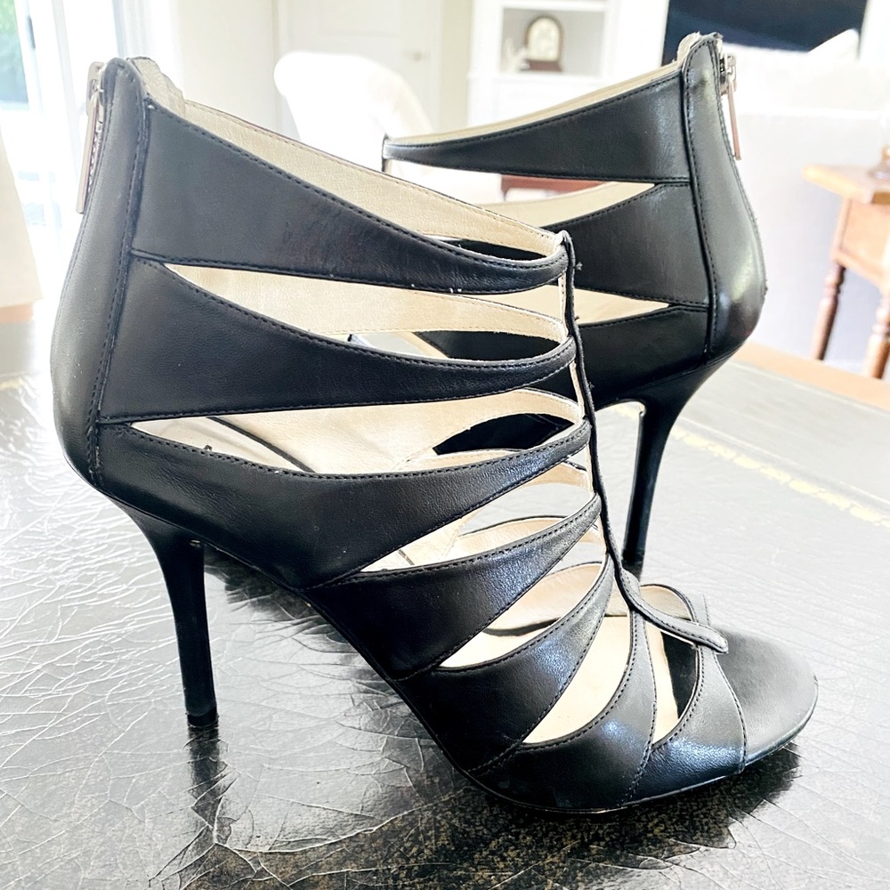 Michael Kors Black heels with back zipper.